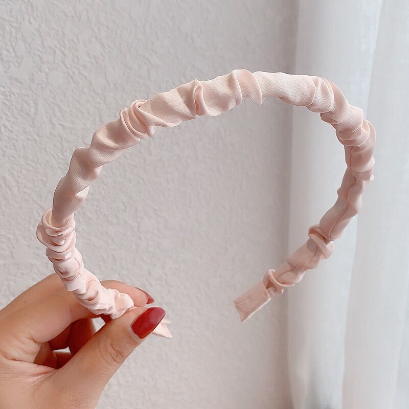 ピンクのヘッドバンド