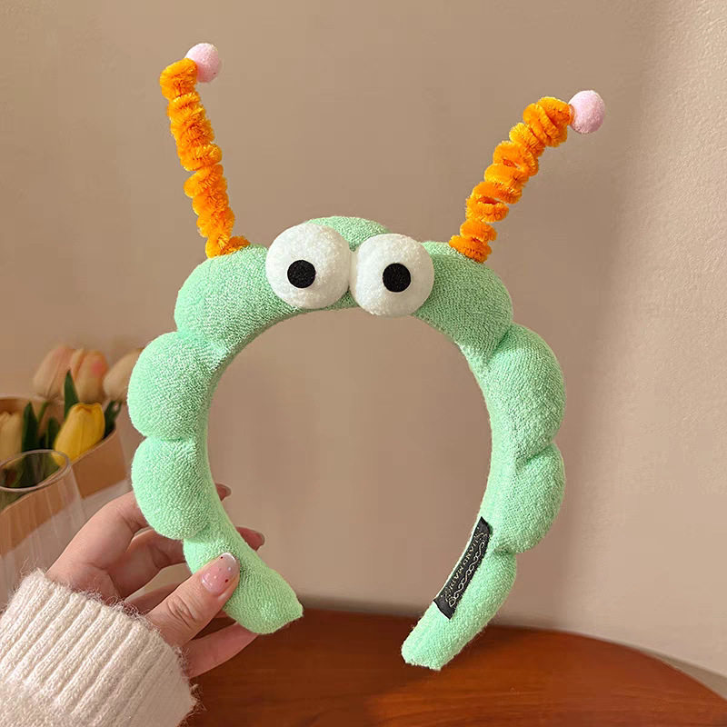 20#ツイストスティックビッグアイグラスグリーンウェーブヘアバンド