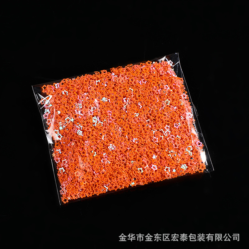 オレンジ色の透かし彫り星1g