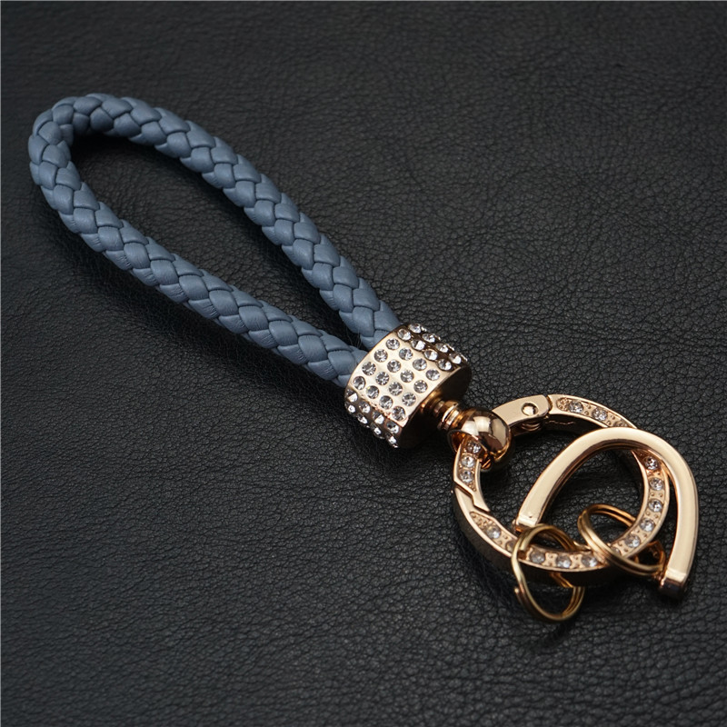 金のボタンの灰色の青い縄