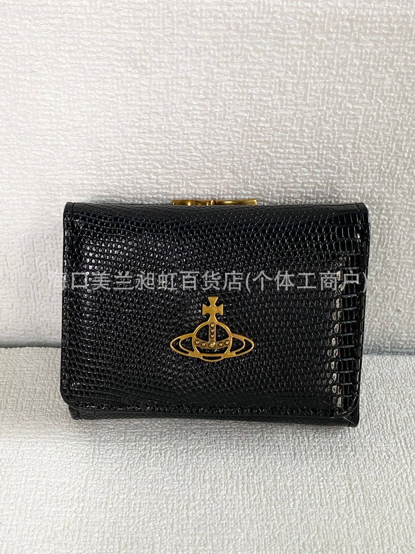 ブラックゴールドのトカゲ柄財布