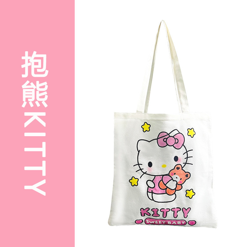 クマを抱きしめる子猫