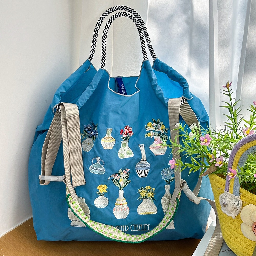 レイクブルーのフラワーアレンジメントボトルにはショルダーストラップは含まれません）