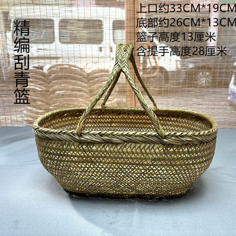 細かく編まれた楕円形の緑の絹のバスケット 小