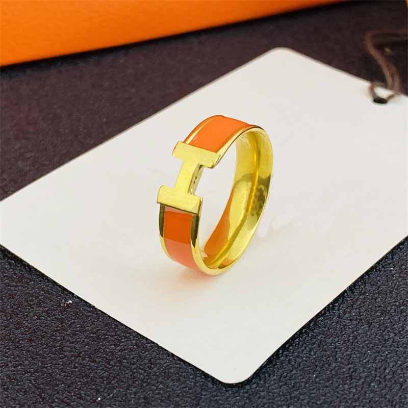 狭い金オレンジ色のH指輪