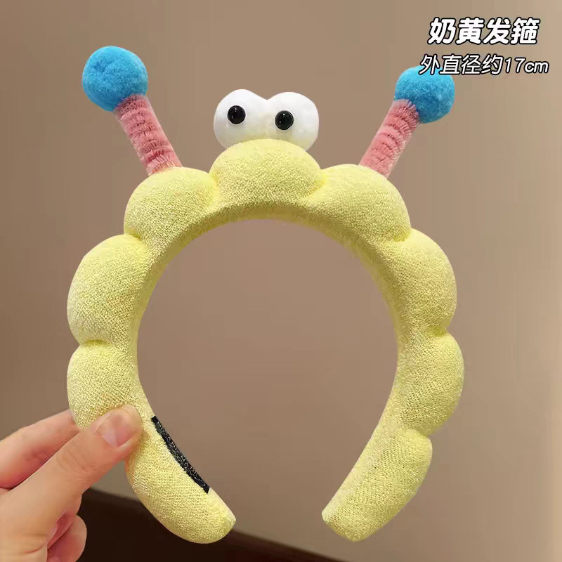 19#ツイストスティック大きな目の黄色の波状ヘアバンド